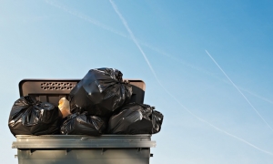 Live better: Rubbish bin against blue sky